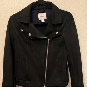 Black moto jacket. Silver zipper and snaps